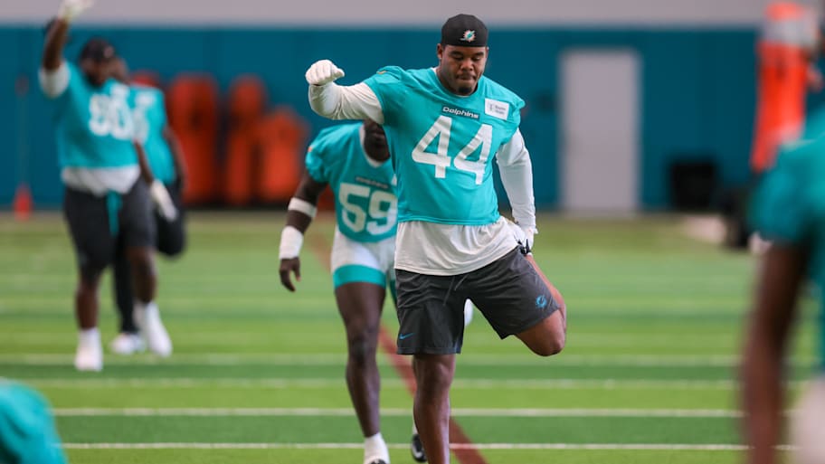 Miami Dolphins linebacker Chop Robinson (44) stretches during mandatory minicamp at Hard Rock Stadium.  | Sam Navarro-Imagn Images