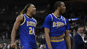 McNeese State Cowboys forward Christian Shumate (24) celebrates with guard Quadir Copeland (11)