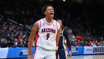 Mar 21, 2025; Seattle, WA, USA; Arizona Wildcats forward Carter Bryant (9) reacts after dunking the ball against the Akron Zips during the first half in the first round of the NCAA Tournament at Climate Pledge Arena. Mandatory Credit: Steven Bisig-Imagn Images