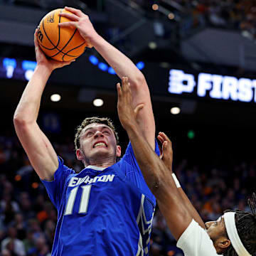 Mar 22, 2025; Lexington, KY, USA;  Creighton Bluejays center Ryan Kalkbrenner (11) shoots the ball against Auburn Tigers guard Chad Baker-Mazara (10) during the second half in the second round to the NCAA Tournament at Rupp Arena. Mandatory Credit: Jordan Prather-Imagn Images