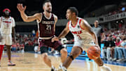 The Ville's Peyton Siva (3) makes his way to the basket around UKnighted's Vance Hall (21) during their game on Saturday, July 20, 2024 in Louisville, Ky. at Freedom Hall during the first round of The Basketball Tournament.