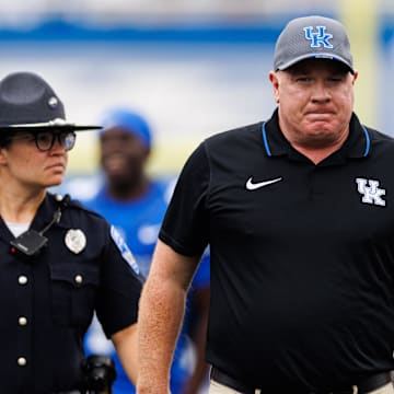 Sep 21, 2024; Lexington, Kentucky, USA; Kentucky Wildcats head coach Mark Stoops walks onto the field before the game against the Ohio Bobcats at Kroger Field. Mandatory Credit: Jordan Prather-Imagn Images