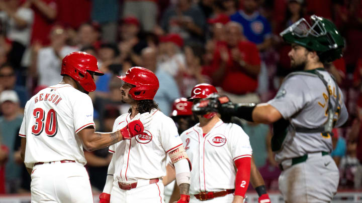 Cincinnati Reds right fielder Will Benson (30) is greeted by Cincinnati Reds second baseman Jonathan India (6) after hitting a 3-run home run in the seventh inning of the MLB game between the Cincinnati Reds and Oakland Athletics at Great American Ball Park in Cincinnati on Wednesday, Aug. 28, 2024.