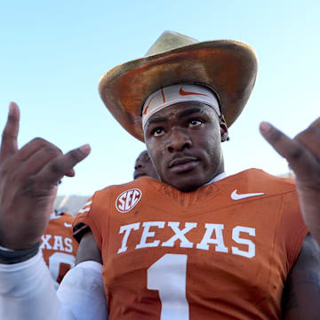Texas Longhorns defensive end Colin Simmons (1) celebrates with the golden hat following the Red River Rivalry college football game between the University of Oklahoma Sooners and the Texas Longhorn at the Cotton Bowl Stadium in Dallas, Texas, Saturday, Oct. 11, 2025.