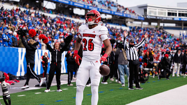 Nov 30, 2024; Lexington, Kentucky, USA; Louisville Cardinals running back Duke Watson (26) celebrates in the end zone after scoring a touchdown during the third quarter against the Kentucky Wildcats at Kroger Field. Mandatory Credit: Jordan Prather-Imagn Images