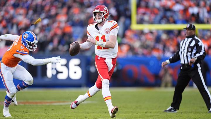 Jan 5, 2025; Denver, Colorado, USA; Kansas City Chiefs quarterback Carson Wentz (11) looks to pass the ball in the second quarter against the Denver Broncos at Empower Field at Mile High. Mandatory Credit: Ron Chenoy-Imagn Images