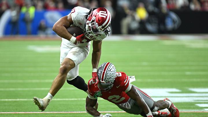 Dec 6, 2025; Indianapolis, IN, USA; Indiana Hoosiers tight end Riley Nowakowski (37) runs against Ohio State Buckeyes safety Caleb Downs (2) in the second quarter during the 2025 Big Ten championship game at Lucas Oil Stadium. Mandatory Credit: Robert Goddin-Imagn Images
