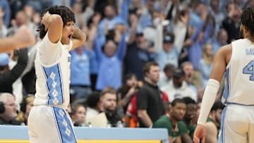 Feb 26, 2024; Chapel Hill, North Carolina, USA; North Carolina Tar Heels guard Elliot Cadeau (2) reacts with guard RJ Davis (4) in the second half at Dean E. Smith Center. Mandatory Credit: Bob Donnan-Imagn Images