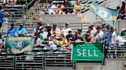 Aug 18, 2024; Oakland, California, USA; Fans display banners and flags in the outfield bleachers during the first inning of the game between the Oakland Athletics and the San Francisco Giants at Oakland-Alameda County Coliseum. Mandatory Credit: Robert Edwards-Imagn Images