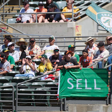 Aug 18, 2024; Oakland, California, USA; Fans display banners and flags in the outfield bleachers during the first inning of the game between the Oakland Athletics and the San Francisco Giants at Oakland-Alameda County Coliseum. Mandatory Credit: Robert Edwards-Imagn Images