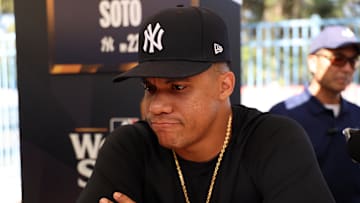 Oct 24, 2024; Los Angeles, CA, USA;  New York Yankees outfielder Juan Soto (22) speaks to media during workout day at Dodgers Stadium. Mandatory Credit: Kiyoshi Mio-Imagn Images