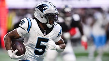 Nov 16, 2025; Atlanta, Georgia, USA; Carolina Panthers running back Rico Dowdle (5) runs with the ball in the third quarter against the Carolina Panthers at Mercedes-Benz Stadium. Mandatory Credit: Brett Davis-Imagn Images