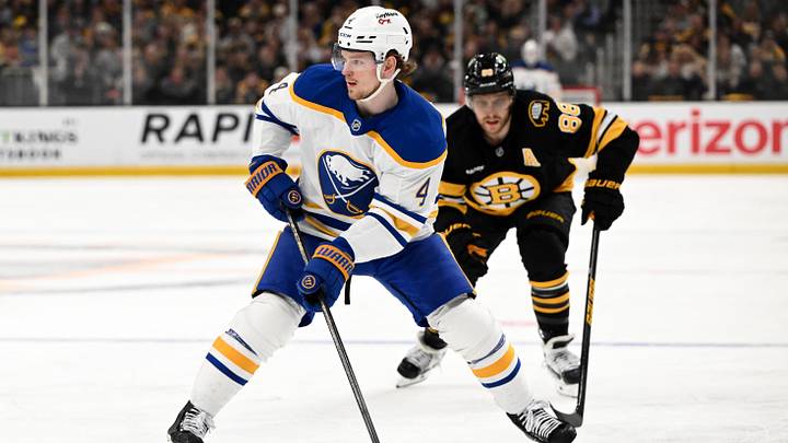 Apr 23, 2026; Boston, Massachusetts, USA; Buffalo Sabres defenseman Bowen Byram (4) skates against Boston Bruins right wing David Pastrnak (88) during the second period of game three of the first round of the 2026 Stanley Cup Playoffs at the TD Garden. Mandatory Credit: Brian Fluharty-Imagn Images