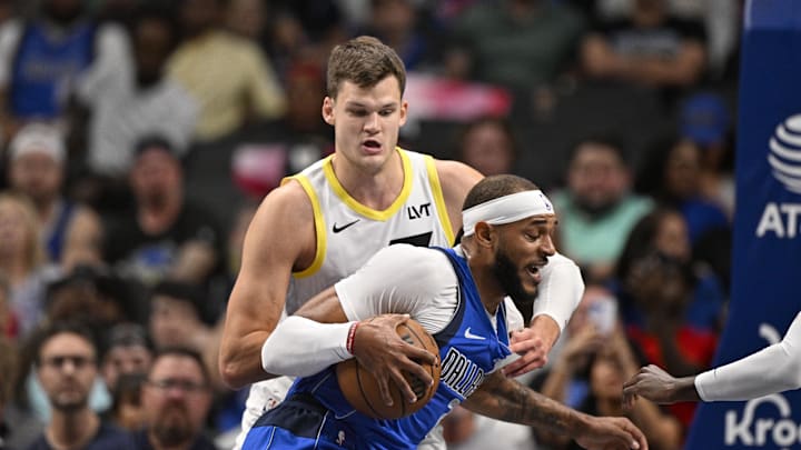 Oct 28, 2024; Dallas, Texas, USA; Utah Jazz center Walker Kessler (24) and Dallas Mavericks center Daniel Gafford (21) in action during the game between the Dallas Mavericks and the Utah Jazz at the American Airlines Center. Mandatory Credit: Jerome Miron-Imagn Images