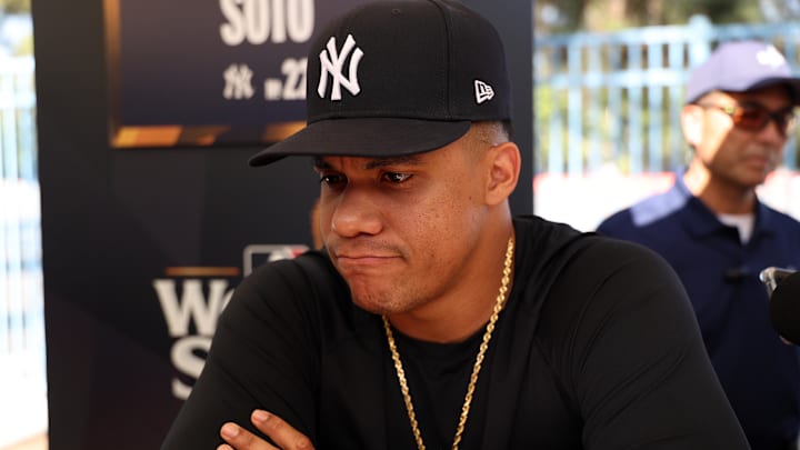 Oct 24, 2024; Los Angeles, CA, USA;  New York Yankees outfielder Juan Soto (22) speaks to media during workout day at Dodgers Stadium. Mandatory Credit: Kiyoshi Mio-Imagn Images