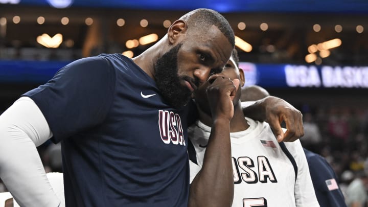 Jul 10, 2024; Las Vegas, Nevada, USA; USA forward Lebron James (6) and guard Anthony Edwards (5) speak on the bench in the fourth quarter against Canada in the USA Basketball Showcase at T-Mobile Arena. Mandatory Credit: Candice Ward-USA TODAY Sports