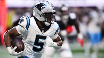 Nov 16, 2025; Atlanta, Georgia, USA; Carolina Panthers running back Rico Dowdle (5) runs with the ball in the third quarter against the Carolina Panthers at Mercedes-Benz Stadium.
