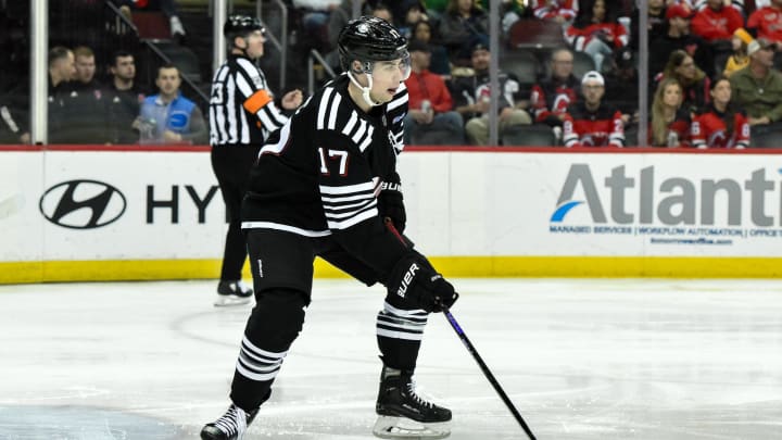 Apr 7, 2024; Newark, New Jersey, USA; New Jersey Devils defenseman Simon Nemec (17) skates with the puck during the third period against the Nashville Predators at Prudential Center. Mandatory Credit: John Jones-USA TODAY Sports