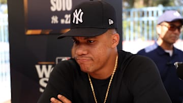 Oct 24, 2024; Los Angeles, CA, USA;  New York Yankees outfielder Juan Soto (22) speaks to media during workout day at Dodgers Stadium. Mandatory Credit: Kiyoshi Mio-Imagn Images