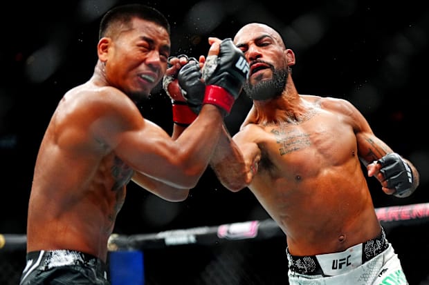 Charles Johnson (blue gloves) knocks out Joshua Van (red gloves) during UFC Fight Night at Ball Arena. 