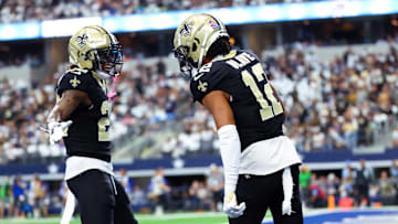 Sep 15, 2024; Arlington, Texas, USA;  New Orleans Saints wide receiver Chris Olave (12) celebrates with New Orleans Saints wide receiver Rashid Shaheed (22) during the first quarter against the Dallas Cowboys at AT&T Stadium. Mandatory Credit: Kevin Jairaj-Imagn Images