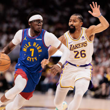 Apr 20, 2024; Denver, Colorado, USA; Denver Nuggets guard Reggie Jackson (7) drives to the basket against Los Angeles Lakers guard Spencer Dinwiddie (26) during the second quarter in game one of the first round for the 2024 NBA playoffs at Ball Arena. Mandatory Credit: Andrew Wevers-USA TODAY Sports