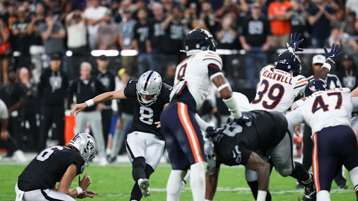 The Bears' Josh Blackwell blocks the Raiders' potential game-winning field goal. The Bears' Josh Blackwell blocks the Raiders' potential game-winning field goal.