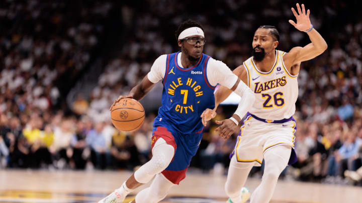 Apr 20, 2024; Denver, Colorado, USA; Denver Nuggets guard Reggie Jackson (7) drives to the basket against Los Angeles Lakers guard Spencer Dinwiddie (26) during the second quarter in game one of the first round for the 2024 NBA playoffs at Ball Arena. Mandatory Credit: Andrew Wevers-USA TODAY Sports