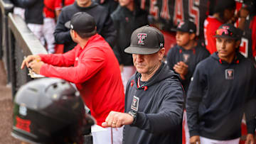 Texas Tech baseball head coach Tim Tadlock gives a Red Raider a fist bump after scoring a run against Oklahoma faces Oklahoma in game two of their Big 12 conference baseball series, Saturday, May 4, 2024, at Rip Griffin Park.