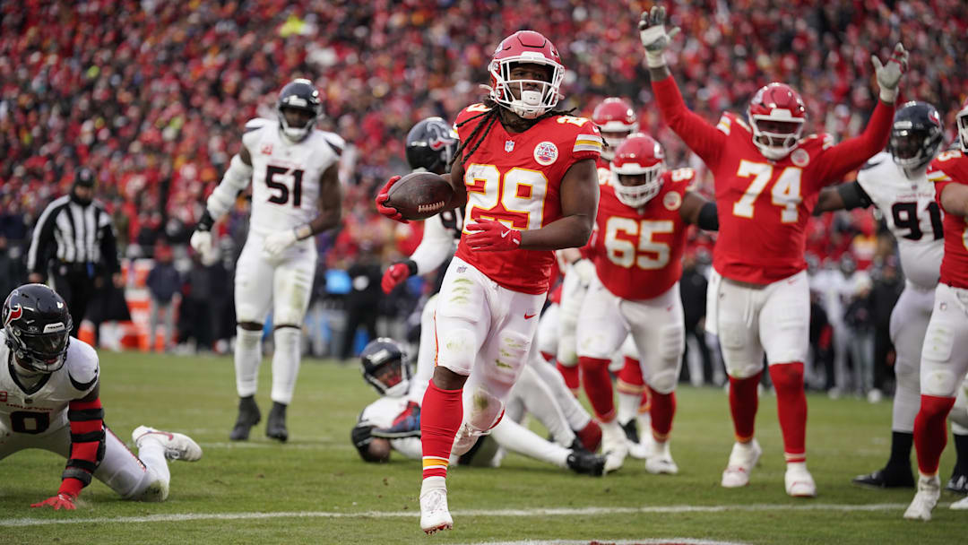Jan 18, 2025; Kansas City, Missouri, USA; Kansas City Chiefs running back Kareem Hunt (29) carries the ball for a touchdown against the Houston Texans during the second quarter of a 2025 AFC divisional round game at GEHA Field at Arrowhead Stadium. Mandatory Credit: Denny Medley-Imagn Images