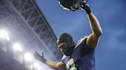 Nov 24, 2024; Seattle, Washington, USA; Seattle Seahawks cornerback Coby Bryant (8) celebrates as he walks to the locker room following a victory against the Arizona Cardinals at Lumen Field. Mandatory Credit: Joe Nicholson-Imagn Images