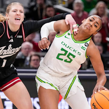 Oregon Ducks guard Deja Kelly (25) rushes past Indiana Hoosiers guard Lexus Bargesser (1) on Thursday, March 6, 2025, during the Big Ten women's tournament at Gainbridge Fieldhouse in Indianapolis.