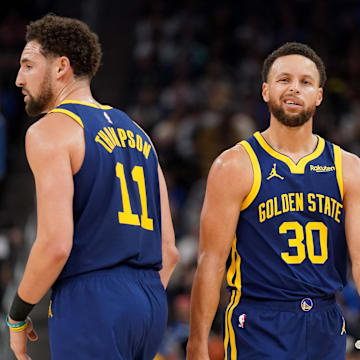 Dec 28, 2023; San Francisco, California, USA; Golden State Warriors guard Stephen Curry (30) stands next to guard Klay Thompson (11) after a play against the Miami Heat in the third quarter at the Chase Center. Mandatory Credit: Cary Edmondson-Imagn Images