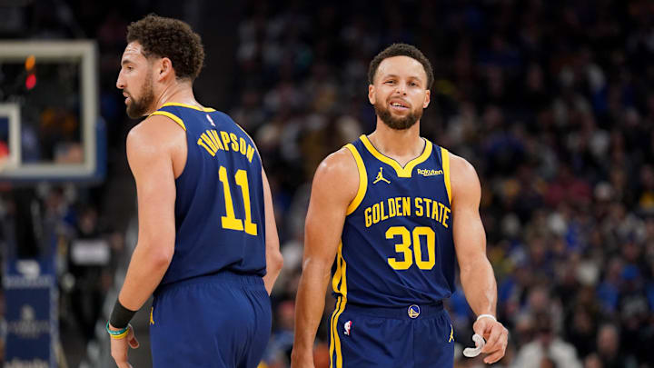 Dec 28, 2023; San Francisco, California, USA; Golden State Warriors guard Stephen Curry (30) stands next to guard Klay Thompson (11) after a play against the Miami Heat in the third quarter at the Chase Center. Mandatory Credit: Cary Edmondson-Imagn Images