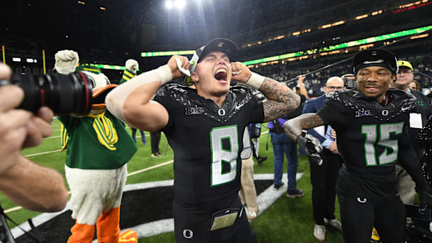 Oregon Ducks quarterback Dillon Gabriel (8) and wide receiver Tez Johnson (15) celebrate defeating the Penn State Nittany Lio