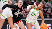 Oregon Ducks guard Deja Kelly (25) rushes past Indiana Hoosiers guard Lexus Bargesser (1) on Thursday, March 6, 2025, during the Big Ten women's tournament at Gainbridge Fieldhouse in Indianapolis.