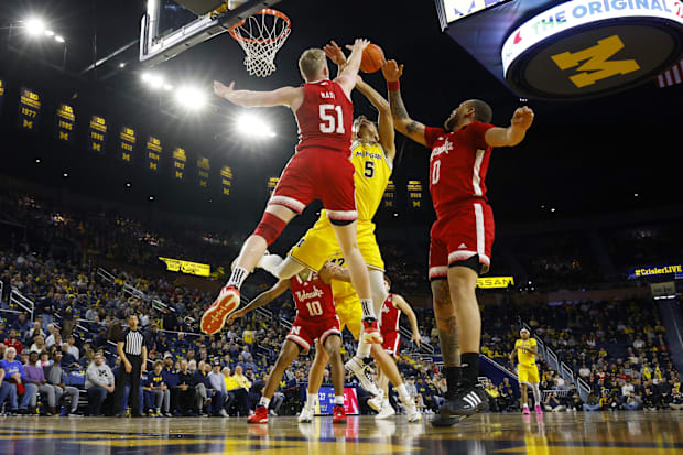 Nebraska Cornhuskers forward Rienk Mast blocks a shot by Michigan Wolverines forward Terrance Williams II.