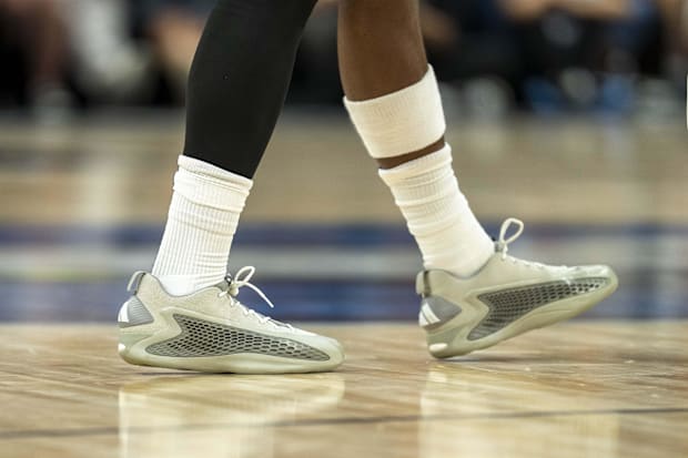 Anthony Edwards' grey and white adidas shoes.