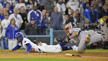 Oct 20, 2024; Los Angeles, California, USA; Los Angeles Dodgers outfielder Mookie Betts (50) is out at home against New York Mets catcher Francisco Alvarez (4) in the eighth inning during game six of the NLCS for the 2024 MLB playoffs at Dodger Stadium. 