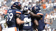 Sep 13, 2025; Charlottesville, Virginia, USA; Virginia Cavaliers running back Harrison Waylee (21) celebrates with teammates after scoring a touchdown against the William & Mary Tribe during the second quarter at Scott Stadium. Mandatory Credit: Amber Searls-Imagn Images