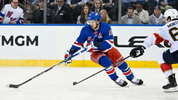 May 30, 2024; New York, New York, USA; New York Rangers left wing Artemi Panarin (10) skates with the puck as Florida Panthers defenseman Brandon Montour (62) defends during the third period in game five of the Eastern Conference Final of the 2024 Stanley Cup Playoffs at Madison Square Garden. Mandatory Credit: Dennis Schneidler-USA TODAY Sports