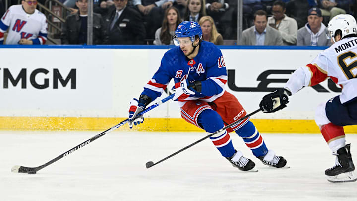 May 30, 2024; New York, New York, USA; New York Rangers left wing Artemi Panarin (10) skates with the puck as Florida Panthers defenseman Brandon Montour (62) defends during the third period in game five of the Eastern Conference Final of the 2024 Stanley Cup Playoffs at Madison Square Garden. Mandatory Credit: Dennis Schneidler-Imagn Images