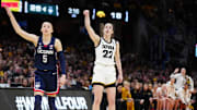 Iowa Hawkeyes guard Caitlin Clark (22) and Connecticut Huskies guard Paige Bueckers