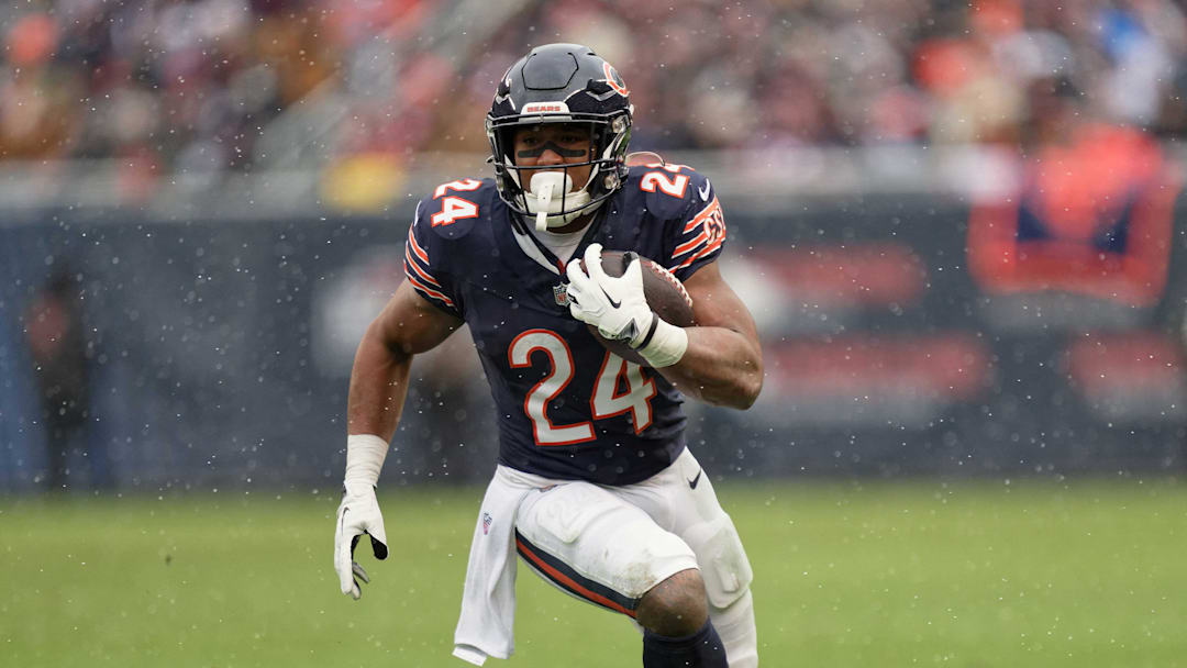 Dec 31, 2023; Chicago, Illinois, USA;  Chicago Bears running back Khalil Herbert (24) runs with the ball against the Atlanta Falcons at Soldier Field. Mandatory Credit: Jamie Sabau-Imagn Images