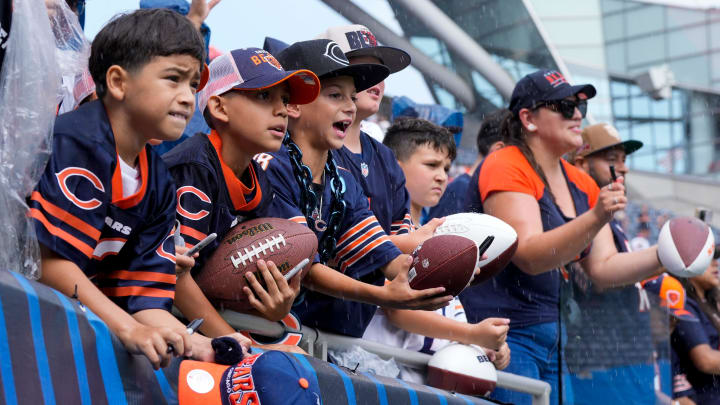 Bears fans call out for autographs after Saturday's game at Soldier Field. 