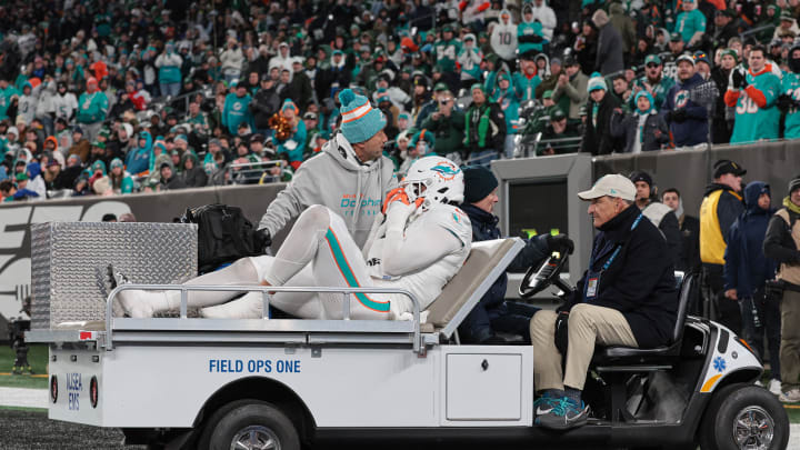 Nov 24, 2023; East Rutherford, New Jersey, USA; Miami Dolphins linebacker Jaelan Phillips (15) is driven off the field after an apparent injury during the second half against the New York Jets at MetLife Stadium. Mandatory Credit: Vincent Carchietta-USA TODAY Sports