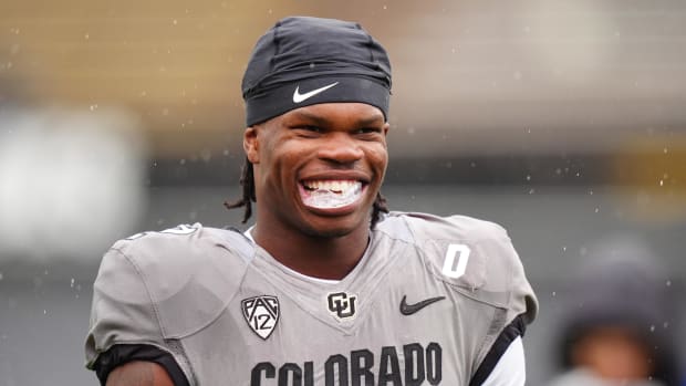 Travis Hunter smiles during warm ups