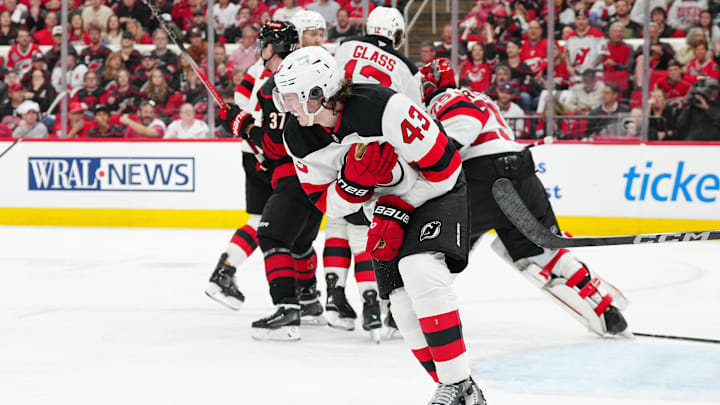 Apr 20, 2025; Raleigh, North Carolina, USA; New Jersey Devils defenseman Luke Hughes (43) reacts after a play against the Carolina Hurricanes during the third period of game one of the first round of the 2025 Stanley Cup Playoffs at Lenovo Center. Mandatory Credit: James Guillory-Imagn Images
