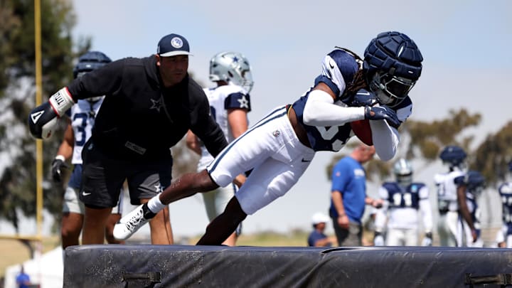 Jul 31, 2024; Oxnard, CA, USA; Dallas Cowboys safety Julius Wood (33) jumps on a pad during training camp at the River Ridge Playing Fields in Oxnard, California. Jul 31, 2024; Oxnard, CA, USA; Dallas Cowboys safety Julius Wood (33) jumps on a pad during training camp at the River Ridge Playing Fields in Oxnard, California.