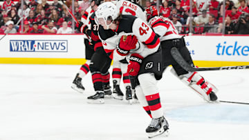 Luke Hughes (43) reacts after a play against the Carolina Hurricanes.  Mandatory Credit: James Guillory-Imagn Images